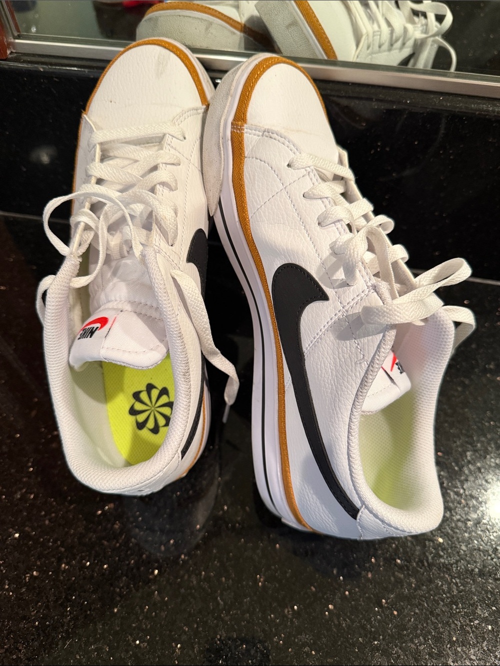 Nike Women’s Size 10 White Sneakers with Black Swoosh and Gold Trim